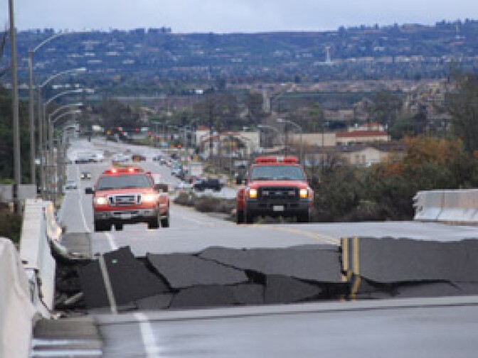 A section of the Boulder Street bridge overpass in Highland collapsed the morning of Wednesday, Dec. 22, 2010 under the surge of the Santa Ana River.