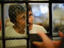  An inmate at Chino State Prison speaks to a parole officer in the overcrowded dayroom of Sycamore Hall that was modified to house prisoners on December 10, 2010 in Chino, California. 