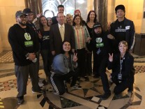 Councilman Paul Koretz stands with vegan activists before introducing a motion in City Council to bring more vegan food to large venues.