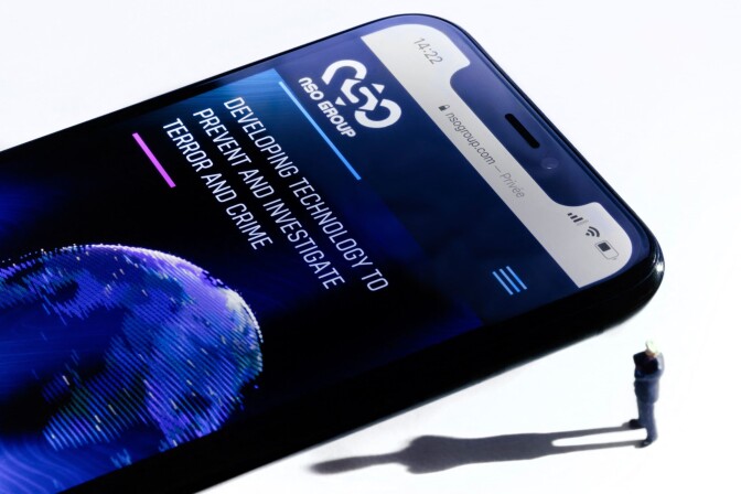 This studio photographic illustration shows a smartphone with the website of Israel's NSO Group which features 'Pegasus' spyware. (JOEL SAGET/AFP via Getty Images)