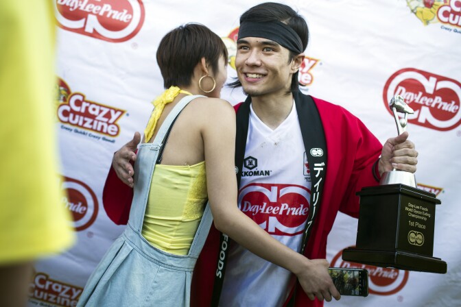 Competitive eater Matt Stonie takes pictures with fans after his first place win at the 2016 World Gyoza Eating Championship at the Japanese American Cultural and Community Center on Saturday, Aug. 20, 2016.