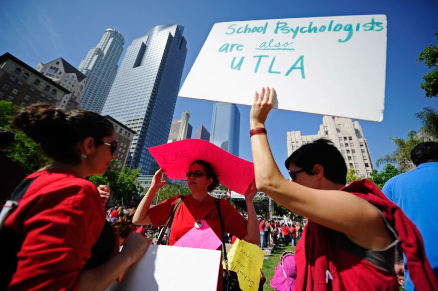 School psychologists (L-R) Jimena Delpozo, Lynn Elias and Diana Socier take part in an education budget cuts rally and protest at Pershing Square on May 13, 2011 in downtown Los Angeles, California. Thousands of teachers, school workers, students and parents took part in a so-called 'State of Emergency' rally calling on the state legislature to maintain funding for education. 