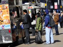 L.A. city councilmen José Huizar and Curren Price say they'll look to cities like New York, seen here, and San Francisco as models for future street vendor regulation.