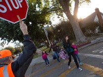 Crossing guard Tony Abdalla ensures children's safety outside of Arroyo Vista Elementary School in South Pasadena.