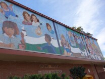 This mural decorates the street-facing wall of Olive Vista Middle School's multipurpose room, also known as Mile's Hall. The building is built of tilt-up concrete slabs, placing it among the most earthquake vulnerable buildings in the LAUSD's 13,000 inventory.