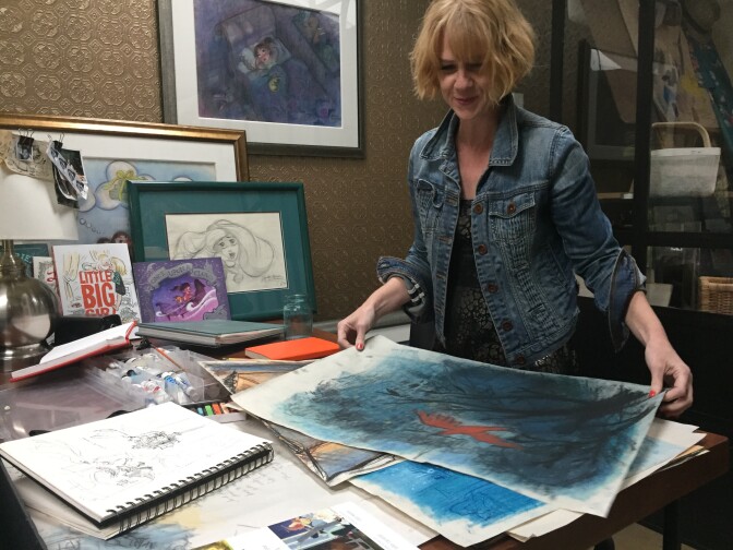 Claire Keane reviews her latest pastel drawings at her art studio at her home in Venice. She uses pastel sketches to inspire artwork in other mediums.  “I can draw in color, which is kind of fun,” Keane says. “I feel more connected to drawing then I do to painting.” Photo by Erika Aguilar. 
