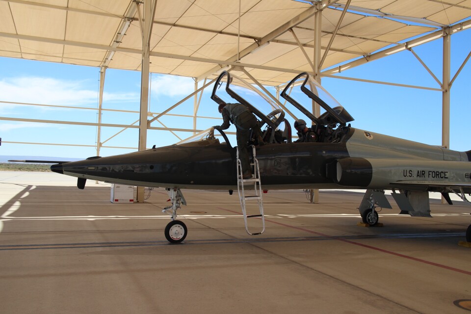 Justin Lechner gets into a T-38 supersonic jet for a practice run.