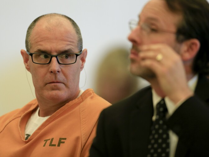 Scott Dekraai, accused of killing eight people in a Seal Beach beauty salon, listens while his attorney, Assistant Public Defender Scott Sanders, addresses the court during a motion hearing in Santa Ana on March 18, 2014. 