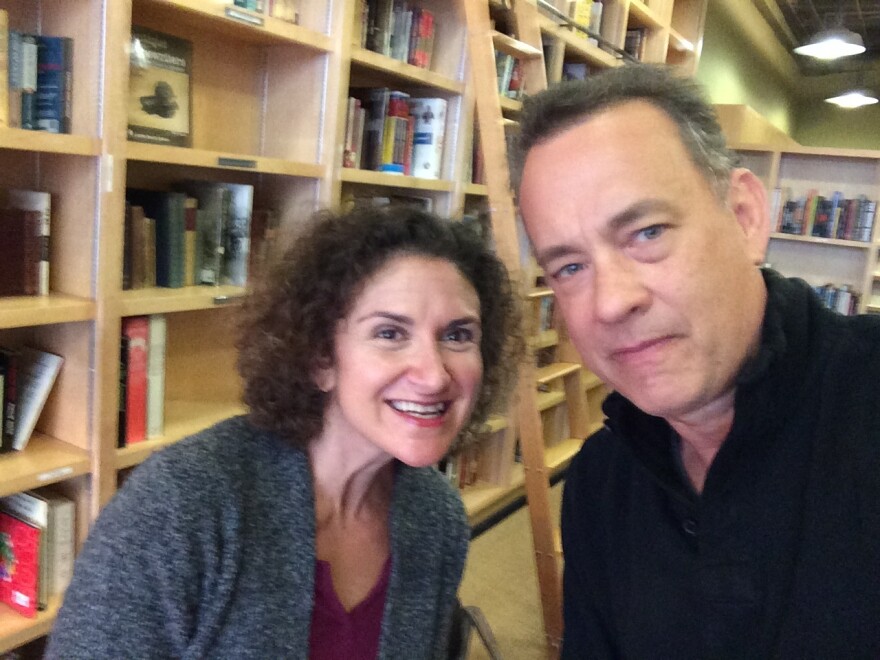 Take Two host Alex Cohen poses for a picture for actor Tom Hanks.