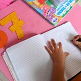 A girl attends a class at home in Cali, Colombia, on August 4, 2020. - The "teacher at home" modality implemented by a local kindergarten seeks to help children keep in touch with teachers and reduce the emotional impact due to isolation during the pandemic. (Photo by LUIS ROBAYO / AFP) (Photo by LUIS ROBAYO/AFP via Getty Images)