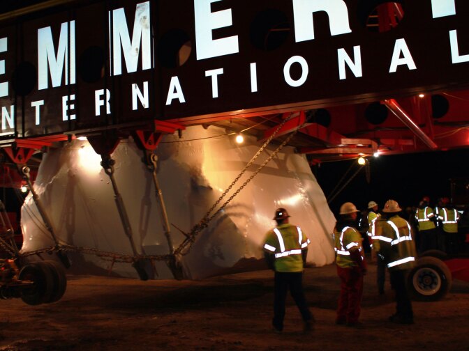 Workers make final preparations Tuesday night before the boulder move begins.