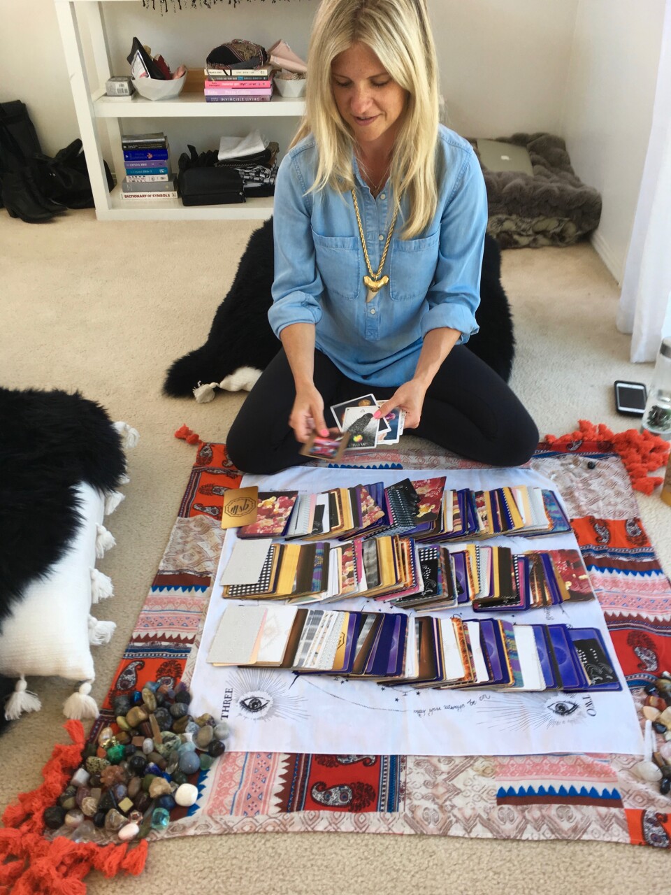 Colleen McCann sits cross-legged at her Venice home, a common spot she seeks clients. She juggles hundreds in both Los Angeles and New York. She even sees clients on Skype. 