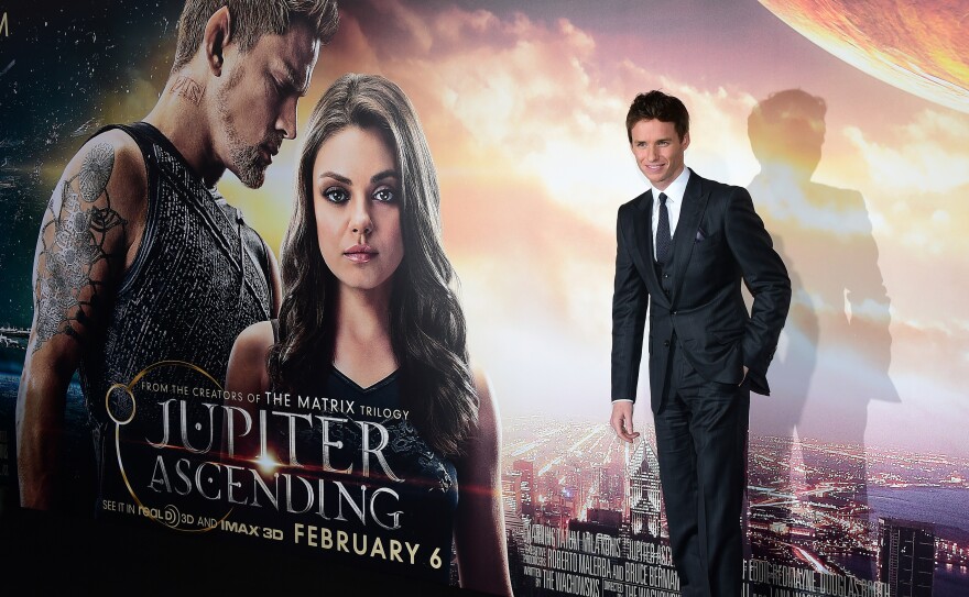 From the cast, actor Eddie Redmayne poses on arrival for the Los Angeles Premiere of the film "Jupiter Ascending" in Hollywood, California on February 2, 2015. The film opens on February 6.  AFP PHOTO / FREDERIC J. BROWN        (Photo credit should read FREDERIC J. BROWN/AFP/Getty Images)
