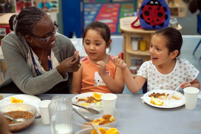 Teacher Lawana teaches preschoolers Marissa Arellano, left, and Andrea Castaneda how to snap their fingers during the afternoon session at Options Head Start in Monrovia back in May, 2013. This program was forced to close it's afternoon classes due to sequestration. 