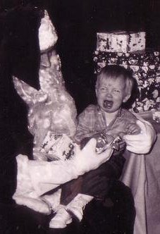 "Picture taken at my dad's unit (military) Christmas party in Germany. They thought it would be fun to have 'Santa' at the party for the kids.  At just over a year old, I'm not having any of it."—Craig Ellefson
