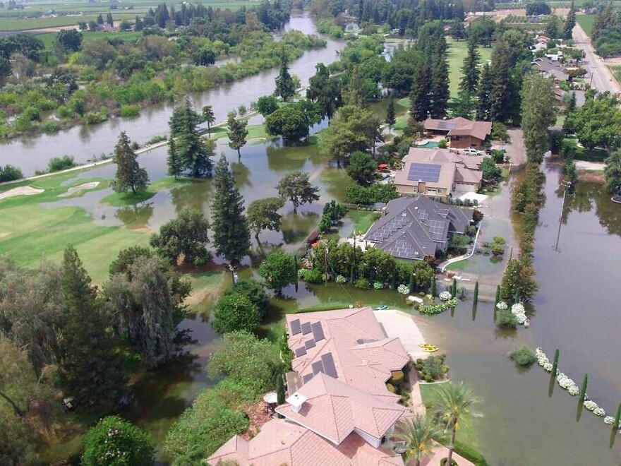 This June 25, 2017, photo taken by an unmanned aerial vehicle and released by the Tulare County Sheriff's Office shows flooding from the Kings River at the Kings River Golf and Country Club in Kingsburg, Calif. The Kings River began to flood about 25 miles (40 kilometers) north of Fresno as temperatures soared, melting snow in the Sierra Nevada and sending it downstream.