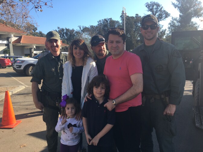 Sally Barati, her husband Shawn Babaieamin and their children had been trapped in their home for three days before these deputies from the Santa Barbara County Sheriff’s Department rescued them from a second story window.
