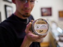 Cody Blake, 27, an employee at Perennial Holisitic Wellness Center in Studio City, displays one of the dispensary's popular marijuana strains.