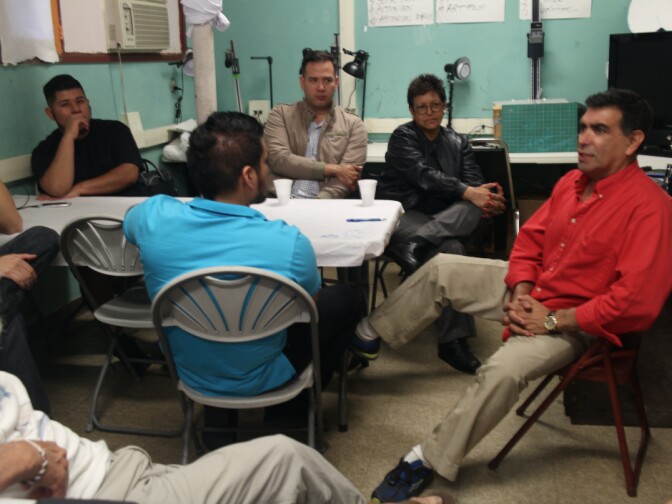 Rubén Amavizca-Murúa talks with aspiring actors at a Grupo Teatro Sinergia workshop before they enter the stage area at the Frida Kahlo Theater. The acting workshops near downtown L.A. are held in Spanish and attract immigrants from Latin America.