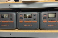 Gray portable backup power batteries on a shelf. 
