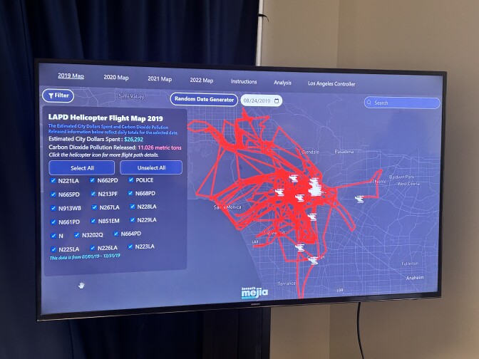 A map of Los Angeles with many red lines criss-crossing over the city. Several white helicopter icons are scattered over the red lines. The text "LAPD Helicopter Flight Map 2019" can be seen on the left. 