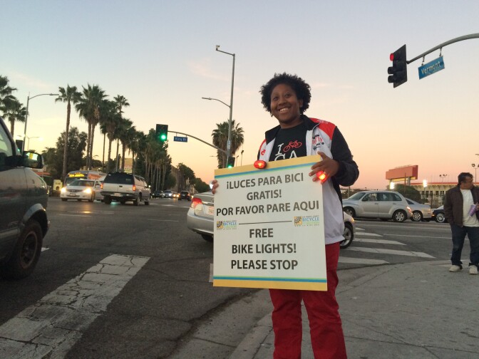 Tamika Butler, executive director of the LA County Bike Coalition, at a corner in South LA. The Coalition hands out free lights to cyclists through its program Operation Firefly.