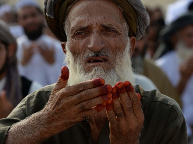 An Afghan resident offers prayers at the start of the Eid al-Fitr holiday which marks the end of Ramadan at open air mosque on the outskirts of Jalalabad on June 25, 2017. / AFP PHOTO / Noorullah SHIRZADA        (Photo credit should read NOORULLAH SHIRZADA/AFP/Getty Images)
