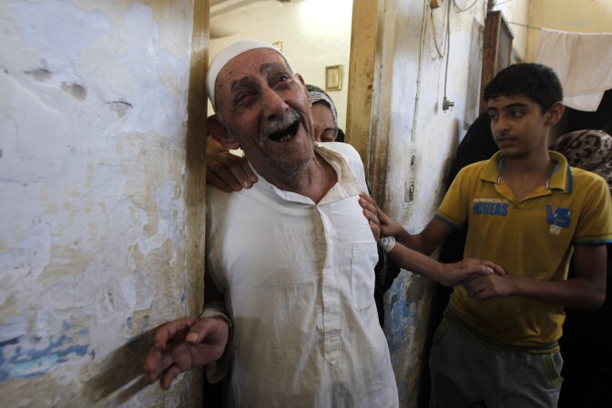 Relatives and friends of al-Hajj family mourn as they gather in a mosque to pray over the bodies of the eight family members during their funeral in Khan Yunis, in the southern Gaza Strip, on July 10, 2014. Israeli warplanes pounded Gaza relentlessly, causing a growing number of civilian casualties, as the UN Security Council was to meet urgently over Israel's spiralling confrontation with Hamas. 