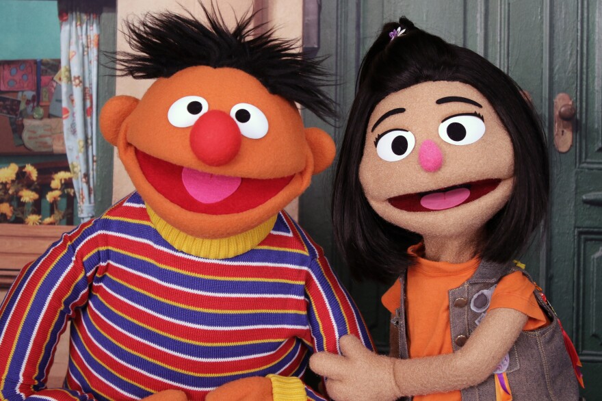 Ernie, a Muppet from the popular children's series <em>Sesame Street</em>, appears with new character Ji-Young, the first Asian American Muppet, on the set of the long-running children's program in New York on Nov. 1.