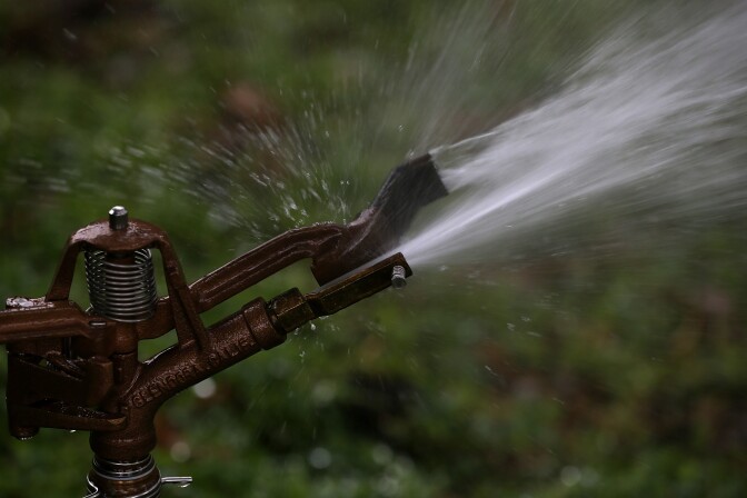 File: A sprinkler sprays water on a lawn at Golden Gate Park on January 29, 2014 in San Francisco, California. 
