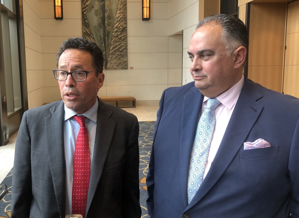 Two middle aged men in suits