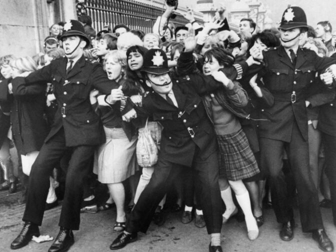 In this file picture taken on )ctober 26, 1965 Beatles fans try to break through a police line at Buckingham Palace in London where the group were due to receive the Member of the British Empire (MBE) decoration from the Queen. The Beatles' debut tune that launched Britain into the '60s and helped to ignite a worldwide obsession for the four-man British rock band celebrates its 50th anniversary on October 5, 2012. Even though it only peaked at no. 17 on the British charts, the single 'Love Me Do' was the rock group's first hit record when released in October 1962.