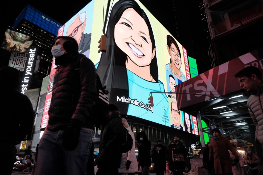 Portraits of Asian victims attacked during the pandemic light up the night sky at Times Square.
