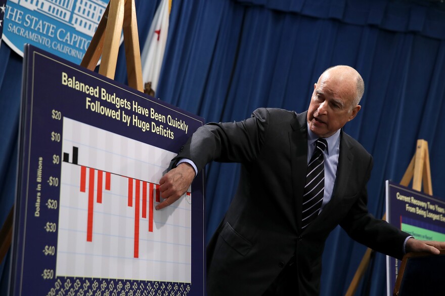SACRAMENTO, CA - MAY 11:  California Gov. Jerry Brown shows charts to reporters during a news conference where he revealed his revised California State budget on May 11, 2017 in Sacramento, California. California Gov. Jerry Brown unveiled a revised, $180 billion budget proposal.  (Photo by Justin Sullivan/Getty Images)