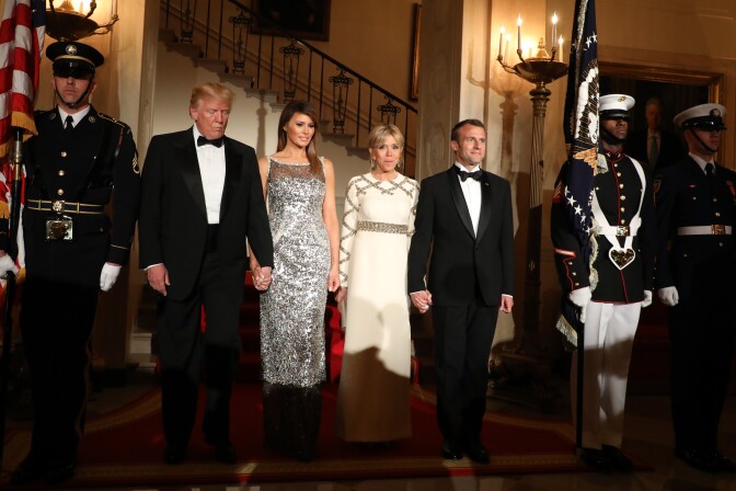 TOPSHOT - US President Donald Trump and First Lady Melania Trump arrive with French President Emmanuel Macron and his wife, Brigitte Macron, for a State Dinner in the White House in Washington, DC, April 24, 2018. (Photo by ludovic MARIN / AFP)        (Photo credit should read LUDOVIC MARIN/AFP/Getty Images)