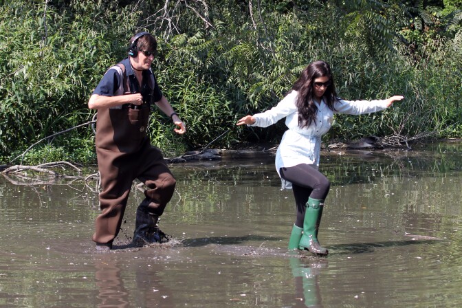 KPCC's John Rabe and Baldwin descendent Margaux Viera extricate themselves from Baldwin Lake at the LA County Arboretum & Botanic Garden. Aug. 23, 2016.