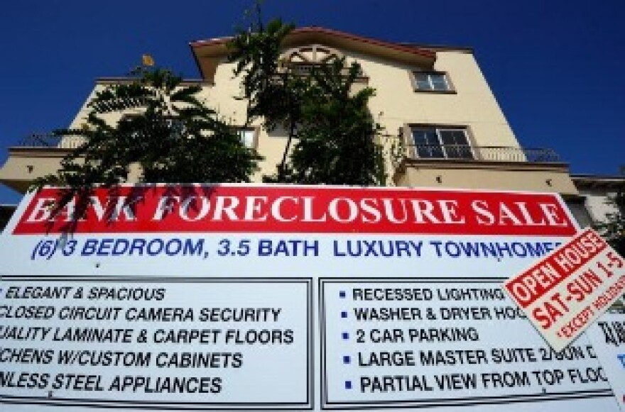 A bank foreclosure sale sign is posted in front of townhomes on August 12, 2010 in Los Angeles, California.