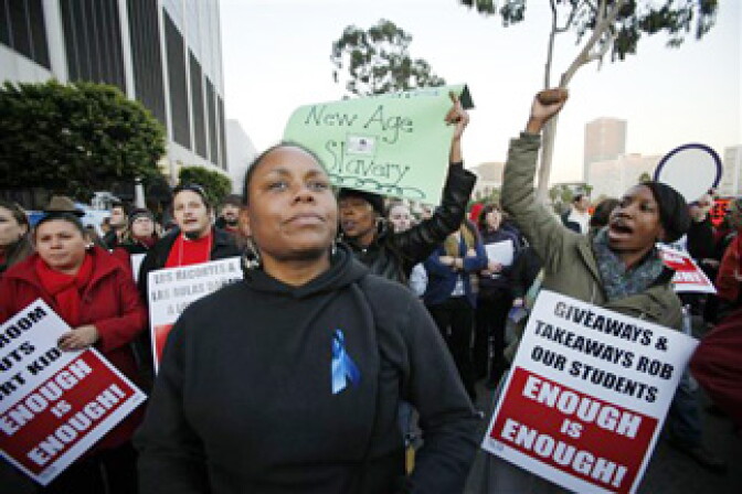 Los Angeles teachers and parents join to protest school cuts outside the offices of the Los Angeles Unified School District on Tuesday, Dec. 8, 2009. in Los Angeles.