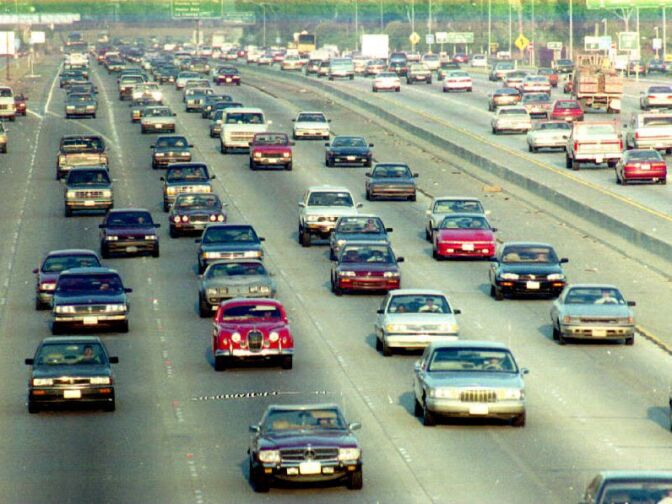 Heavy traffic rolls on the Santa Monica Freeway, Los Angeles, CA after it was reopened 12 April 1994 after repair work was finished on damage done by the 17 Jan earthquake that hit the Southern California area. This freeway is the most heavily travelled freeway in the world