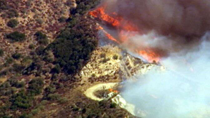 A wildfire burns in San Bernardino County Monday, Nov. 5, 2012. Statistics from the National Interagency Fire Center show more than 9.2 million acres have been charred by wildfire so far this year. Colorado, California, Idaho and several Western states saw more land burned in 2012 than the previous year.