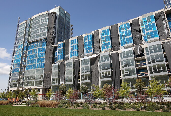 SAN FRANCISCO, CA - MARCH 23:  Plastic is shown on windows of a new luxury apartment building that is under construction on March 23, 2012 in San Francisco, California. After years of being dormant, new apartment construction in the city of San Francisco is set to take off as the city's technology sector continues to grow. Nearly 22,000 apartment units are currently in various stages of permit approvals and construction.  (Photo by Justin Sullivan/Getty Images)
