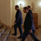 While whistling and singing 'Zip-a-Dee-Doo-Dah,' Speaker of the House John Boehner (R-OH) walks past a statue bust of President Abraham Lincoln after arriving at the U.S. Capitol July 29, 2011 in Washington, DC.