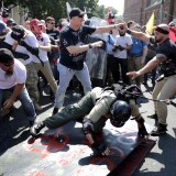 CHARLOTTESVILLE, VA - AUGUST 12:  White nationalists, neo-Nazis and members of the "alt-right" clash with counter-protesters as they enter Emancipation Park during the "Unite the Right" rally August 12, 2017 in Charlottesville, Virginia. After clashes with anti-fascist protesters and police the rally was declared an unlawful gathering and people were forced out of Emancipation Park, where a statue of Confederate General Robert E. Lee is slated to be removed.  (Photo by Chip Somodevilla/Getty Images)