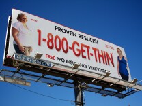 A billboard for the Lap Band over the 210 freeway.