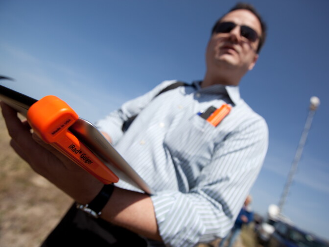 Bill Cardoso, president of Creative Electron, uses an iPad-based geiger counter to measure radiation levels at San Onofre State Beach near the inactive nuclear plant on April 6, 2012.