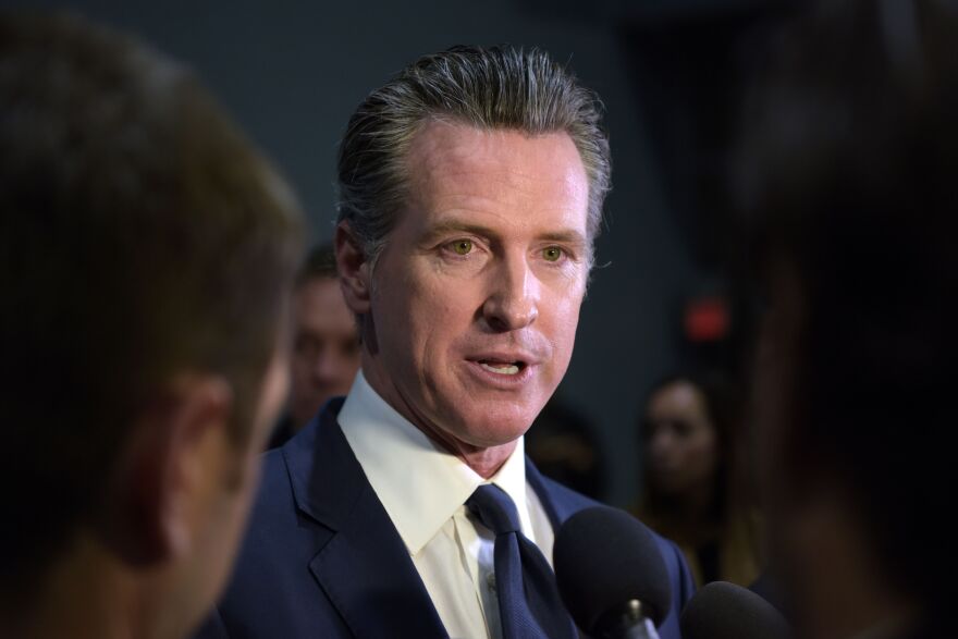 California Governor Gavin Newsom speaks to the press in the spin room after the sixth Democratic primary debate of the 2020 presidential campaign season co-hosted by PBS NewsHour & Politico at Loyola Marymount University in Los Angeles, California on December 19, 2019. (Photo by Agustin PAULLIER / AFP) (Photo by AGUSTIN PAULLIER/AFP via Getty Images)