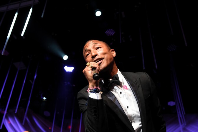 Recording artist Pharrell Williams performs onstage at the Pre-GRAMMY Gala and Salute To Industry Icons honoring Martin Bandier at The Beverly Hilton Hotel on February 7, 2015 in Beverly Hills, California. 