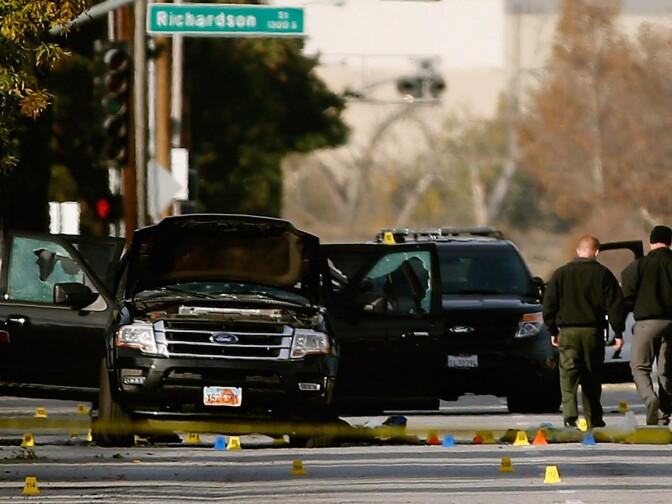 FBI agents and local law enforcement examine the crime scene where suspects of the Inland Regional Center were killed on December 3, 2015 in San Bernardino, California. Police continue to investigate a mass shooting at the Inland Regional Center in San Bernardino that left at least 14 people dead and another 17 injured. 