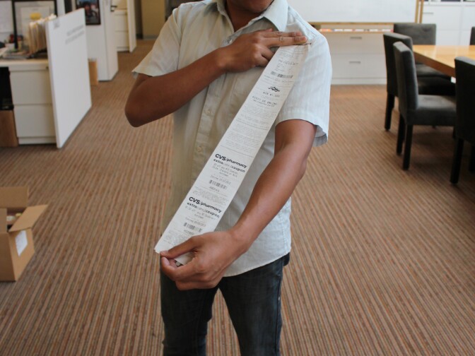 Take Two producer Leo Duran shows his long CVS receipt. 