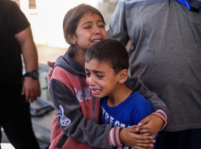 Children crying because of Israeli raids in Khan Yunis, Gaza.